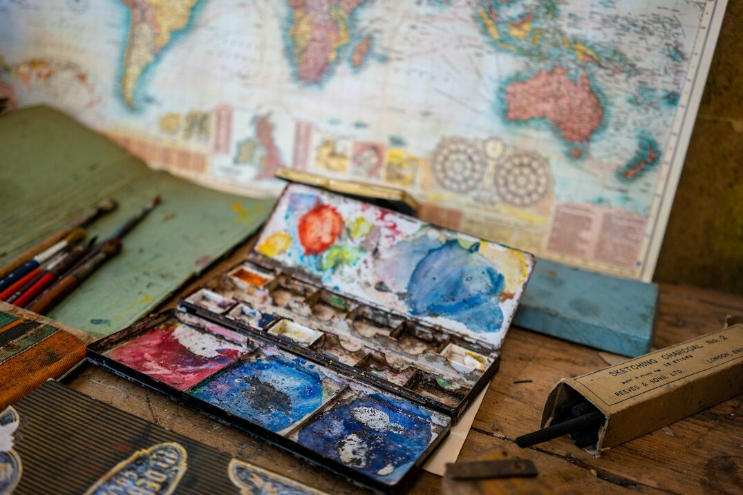 Map and travel planning items on a table
